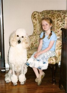 Our daughter Lexie with Enya our female cream Poodle